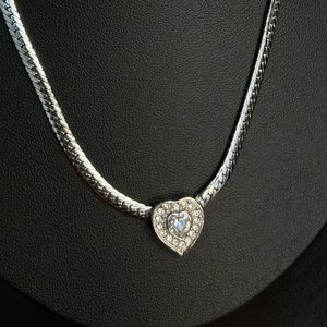 Vintage 80s Christian Dior silver tone heart necklace with herringbone chain.